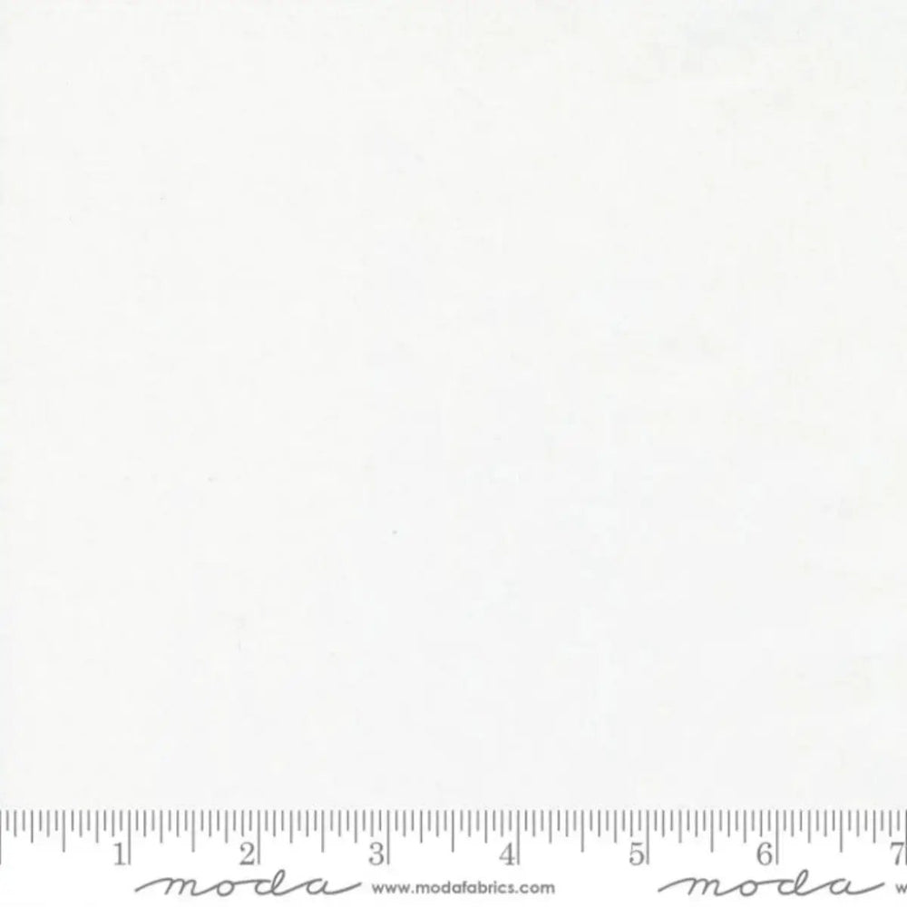 Moda Bella Silky White Bleached 9900 98S solid white cotton quilting fabric with a smooth, subtle sheen.