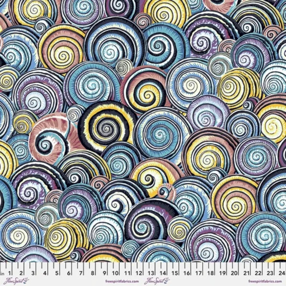 FreeSpirit Spiral Shells Contrast PWPJ073.CONTR cotton quilting fabric featuring colorful overlapping seashells in blue, yellow, lilac, and pink.