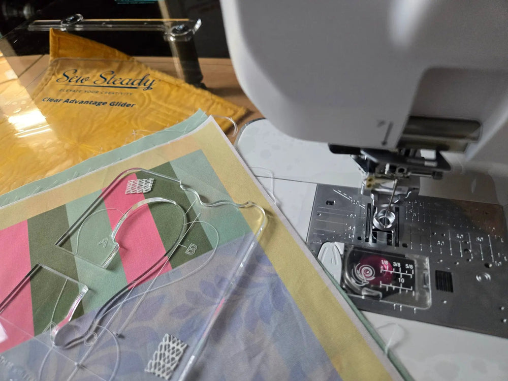 Sew Steady Clear Ruler Work Glider; clear acrylic grid rulers (A/B) beside a sewing machine