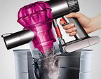 Dyson V6 Motorhead handheld vacuum with pink cyclone housing and clear dustbin.