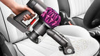 Dyson V6 Motorhead Vacuum; cordless handheld with purple cyclone cleaning car seats