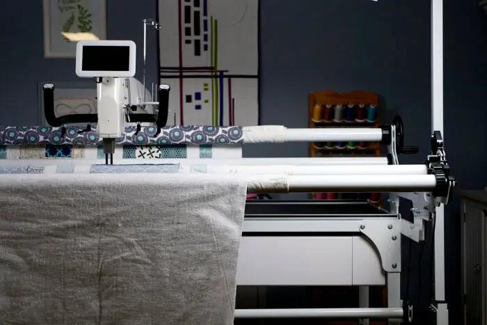 HQ My Secret Drawer quilting frame accessory on Handi Quilter frame with fabric loaded