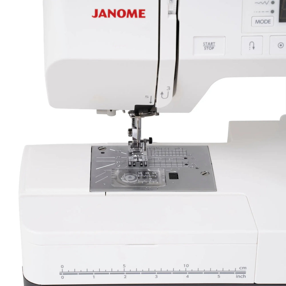 Janome SewSwitch 30 sewing and overlocker combi machine, white body with visible needle area and ruler bed