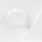 Sewing machine control knob; white plastic dial on a white surface.
