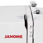 Janome SewSwitch 30 serger sewing machine in white with JANOME logo and stitch dials.