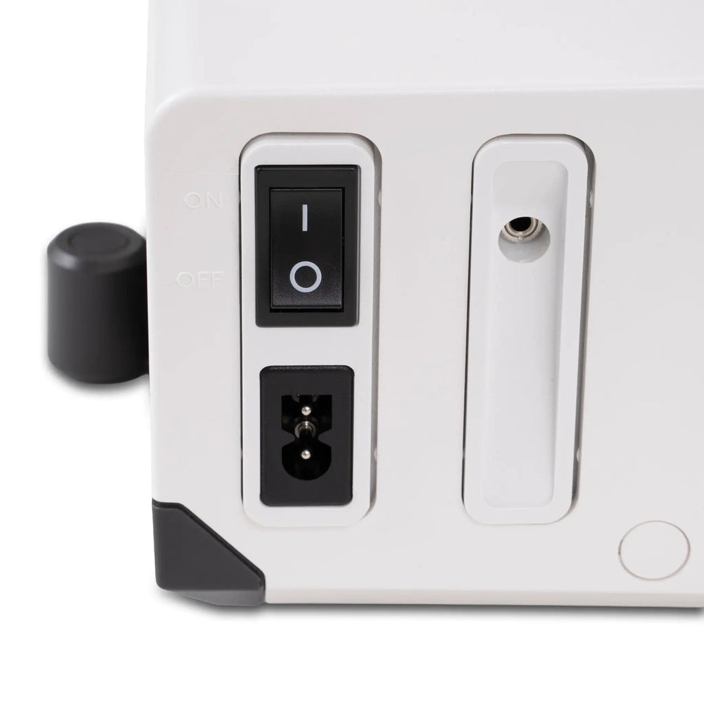 Janome SewSwitch 30 sewing and overlocker combi machine, white body with black power switch.
