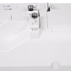 Janome SewSwitch 30 sewing machine; white body with metal presser foot and dials.