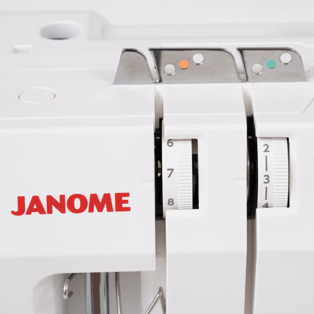 Janome SewSwitch 30 sewing and overlocker combi machine; white body with metal presser feet