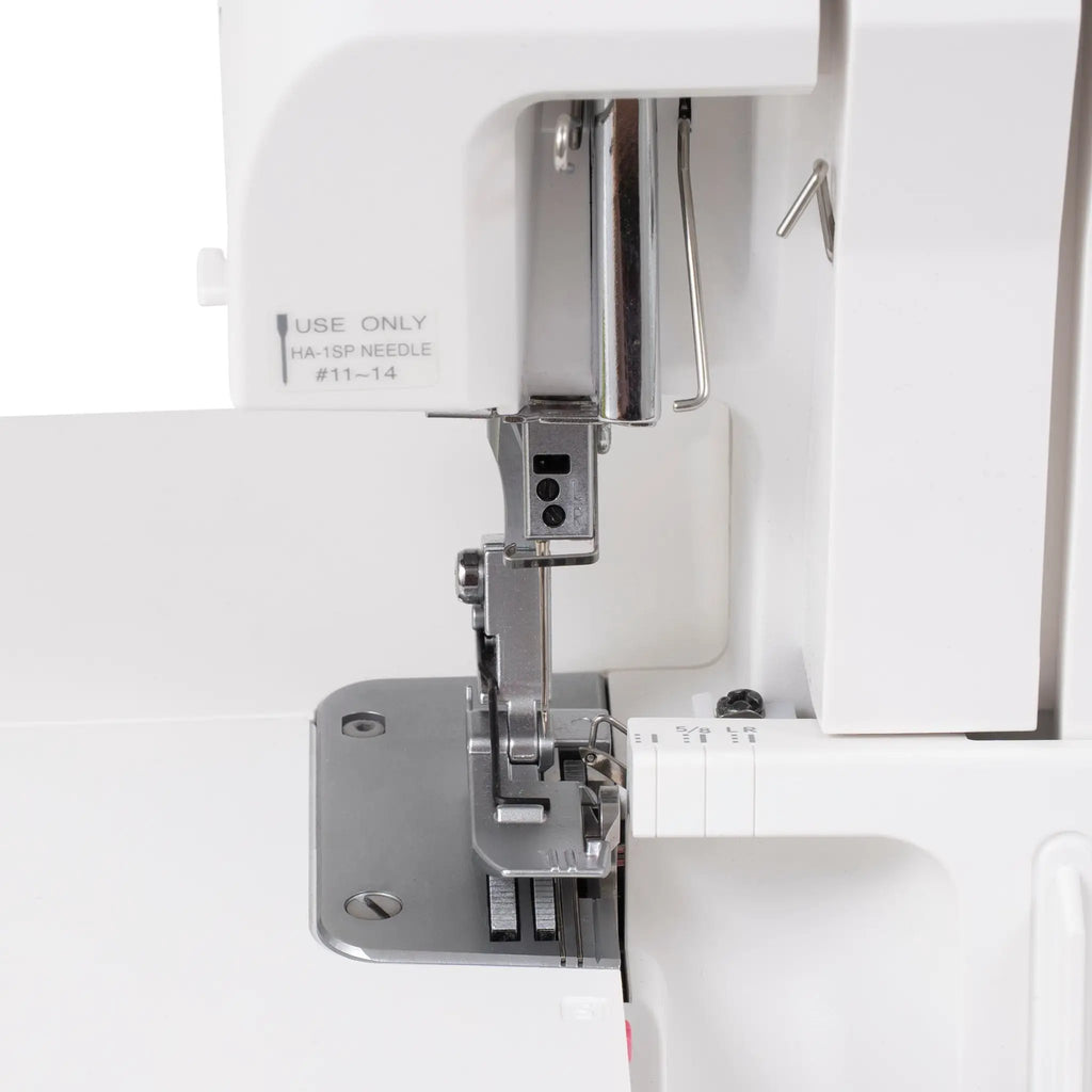 Janome SewSwitch 30 sewing & overlocker combi machine, needle area with presser foot and metal frame