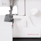 Janome SewSwitch 30 sewing & overlocker combi machine, white body with red SewSwitch 30 logo