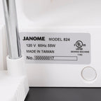 Janome sewing machine label showing model 824, 120 V 60 Hz 55 W, made in Taiwan.