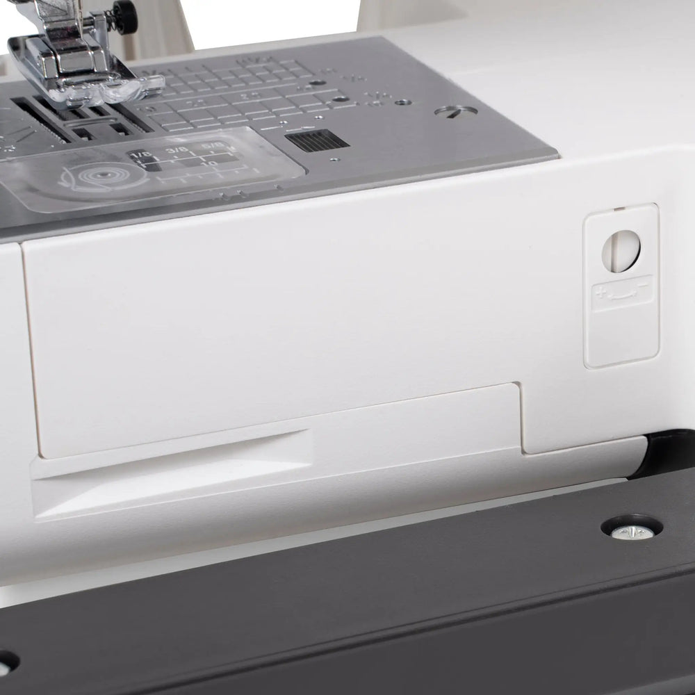 Janome SewSwitch 30 sewing machine; gray body with metal needle plate and presser foot