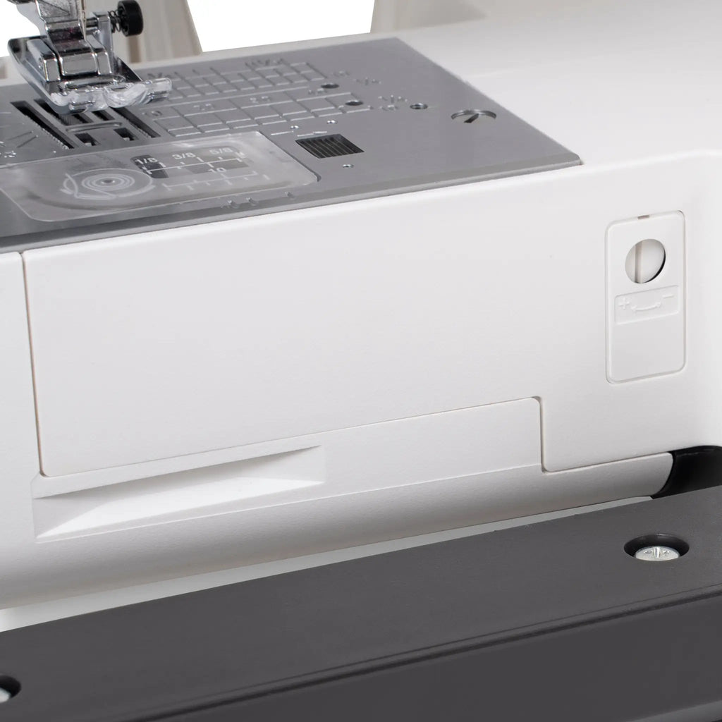 Janome SewSwitch 30 sewing machine; gray body with metal needle plate and presser foot