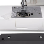 Janome SewSwitch 30 sewing & overlocker combi machine; close-up of metal needle plate and presser foot