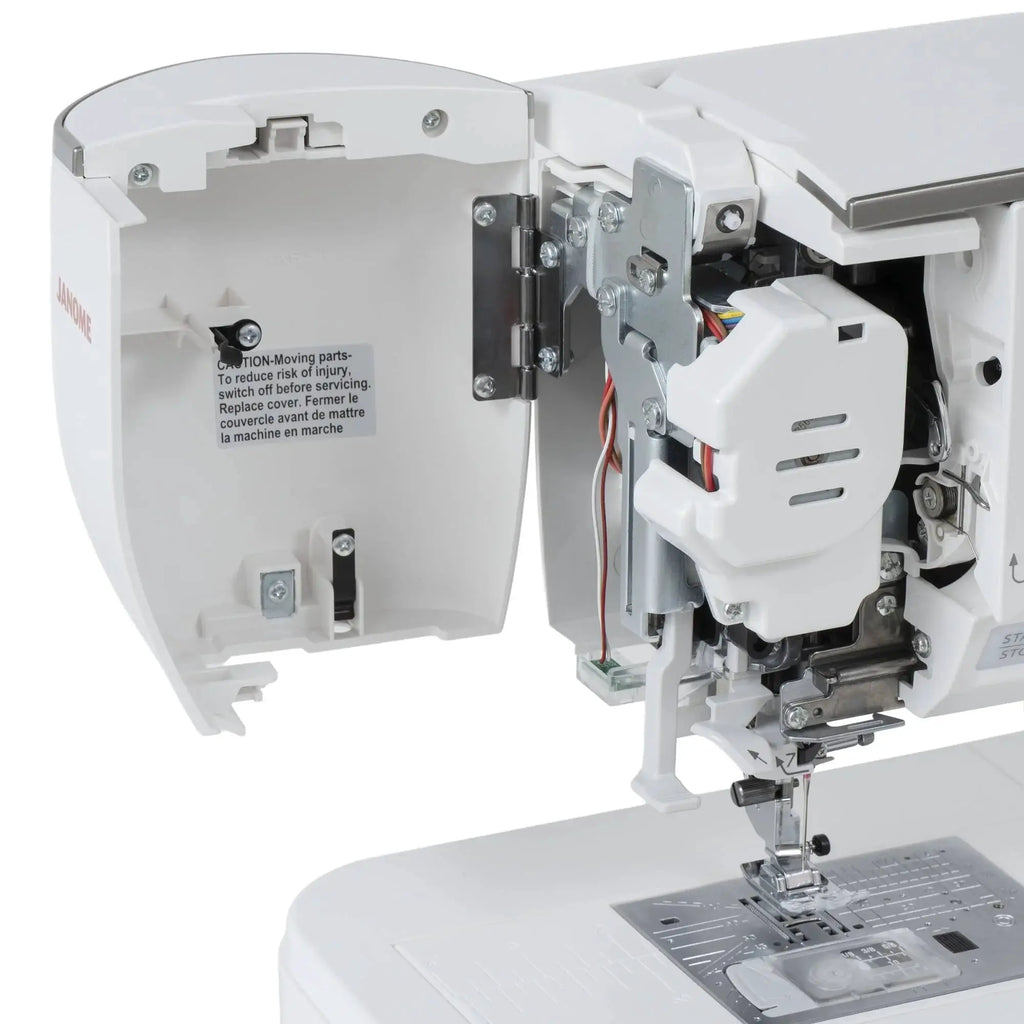 Janome Skyline 8 sewing and quilting machine, computerized, white exterior with open housing showing components.