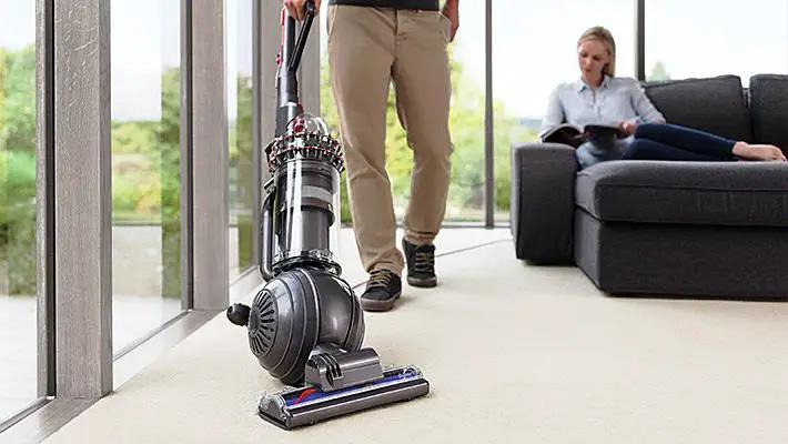 Dyson Cinetic Big Ball Animal + Allergy UP14ANA vacuum cleaner, gray, on carpet in a living room