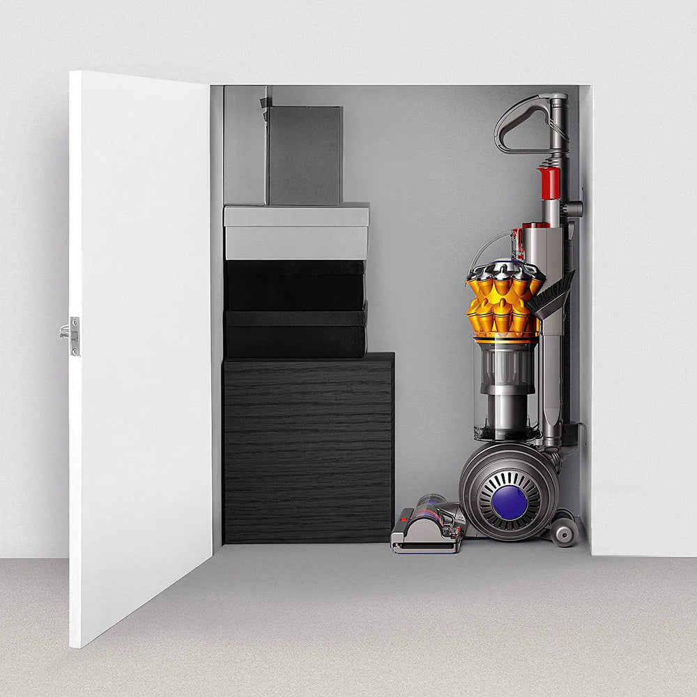 Dyson Small Ball Multifloor UP15MF vacuum cleaner, silver with purple accents, in a closet.