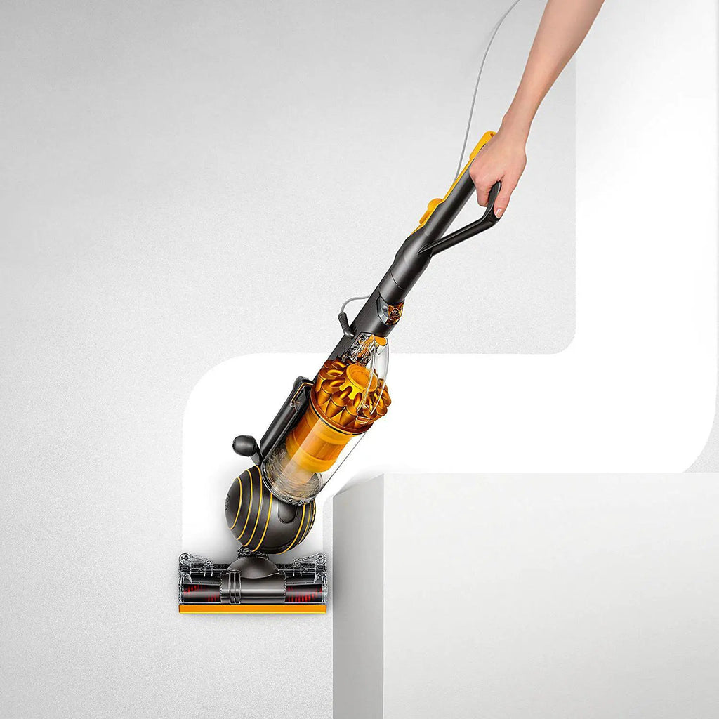 Dyson Ball Multifloor II upright vacuum with yellow cyclone and black handle.