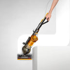 Dyson Ball Multifloor II upright vacuum with yellow cyclone and black handle.