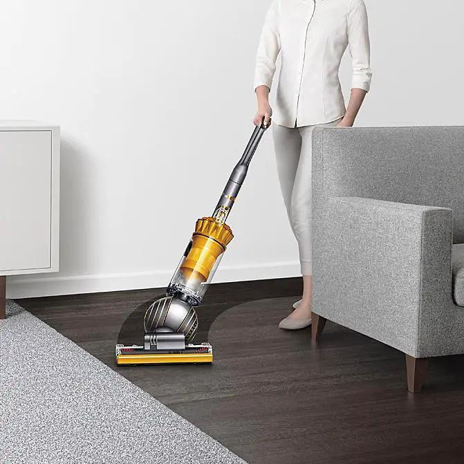 Dyson Ball Multifloor II UP19MF vacuum; yellow canister with a gray body on hardwood floor.