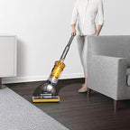 Dyson Ball Multifloor II UP19MF vacuum; yellow canister with a gray body on hardwood floor.