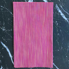 Space Dye Berry yarn-dyed woven cotton fabric with berry, raspberry, magenta, and pink vertical tonal texture.