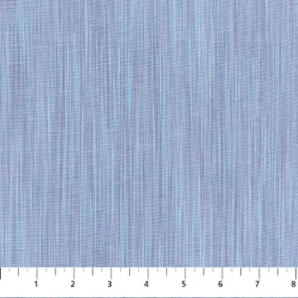 Space Dye Cloud yarn-dyed woven cotton fabric with soft blue tonal vertical texture by FIGO Fabrics.