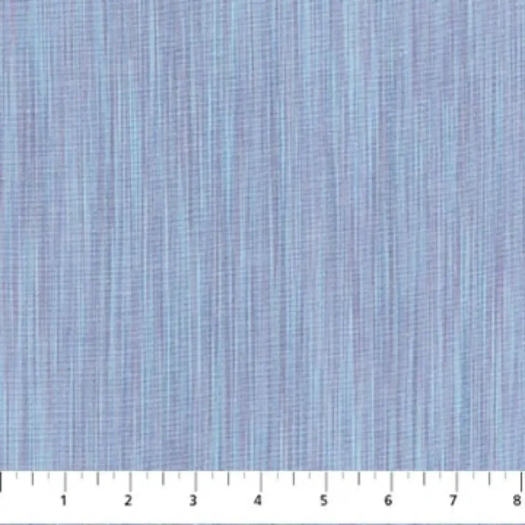 Space Dye Cloud yarn-dyed woven cotton fabric with soft blue tonal vertical texture by FIGO Fabrics.