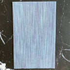 Space Dye Cloud yarn-dyed woven cotton fabric with soft blue tonal vertical texture by FIGO Fabrics.