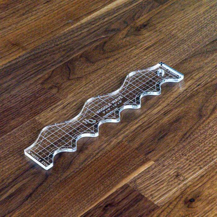 Handi Quilter Wiggle Wave Ruler, clear acrylic quilting ruler with grid lines and wavy edges