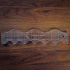 Handi Quilter Wiggle Wave ruler, clear acrylic quilting ruler with grid and wave edges.