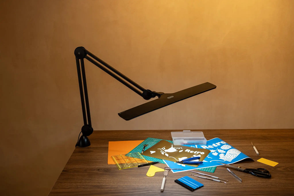 Lumi Task Lamp Satin Black by Daylight, adjustable desk lamp with dual arms.