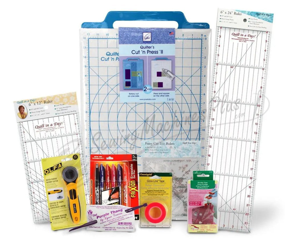 Quilter's Accessory Package quilting kit featuring blue ruler mat, large grid rulers, rotary cutter, pens and tape by SewingMachinesPlus