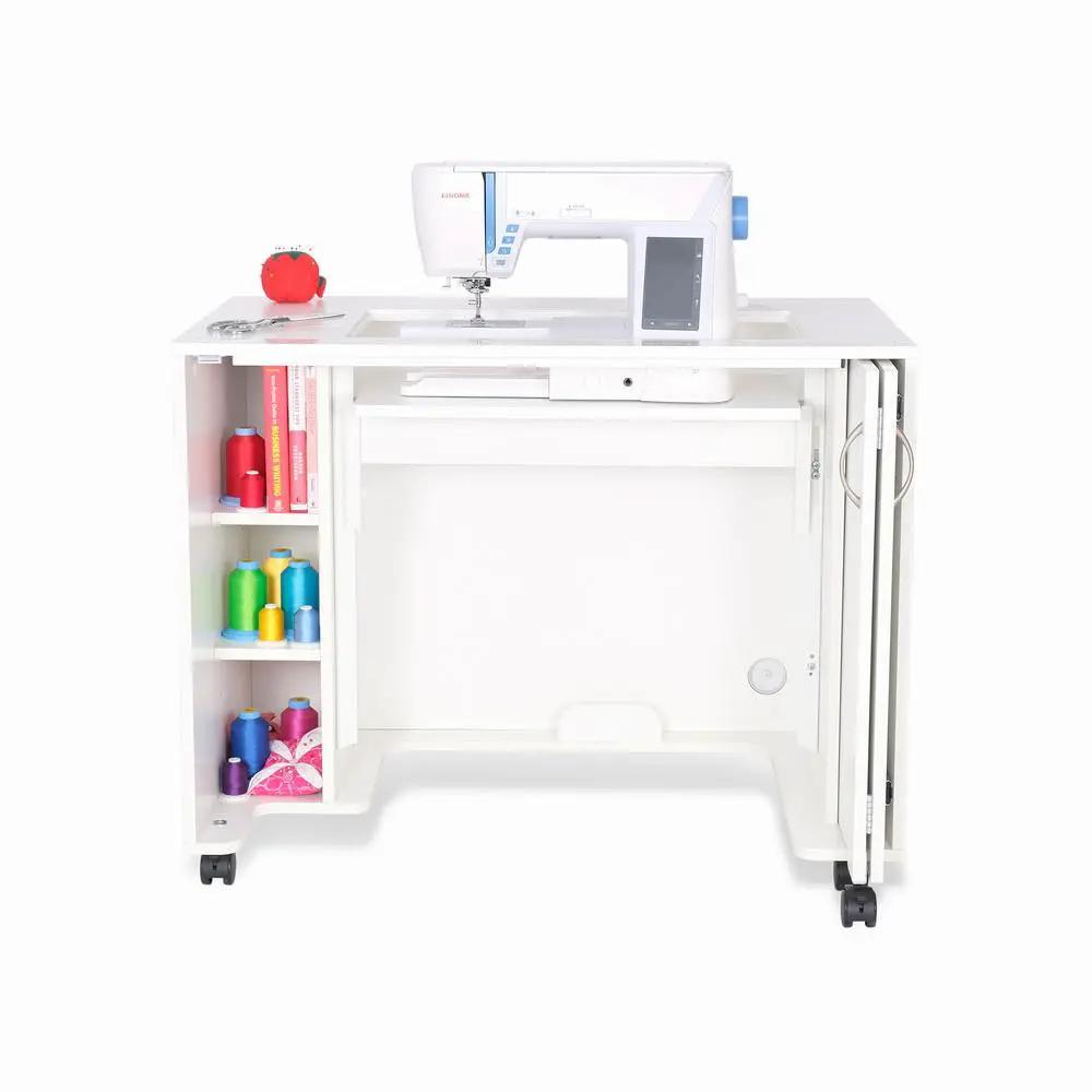 Arrow Mod Sewing Cabinet in white with top-mounted sewing machine and left storage for thread spools on wheels.