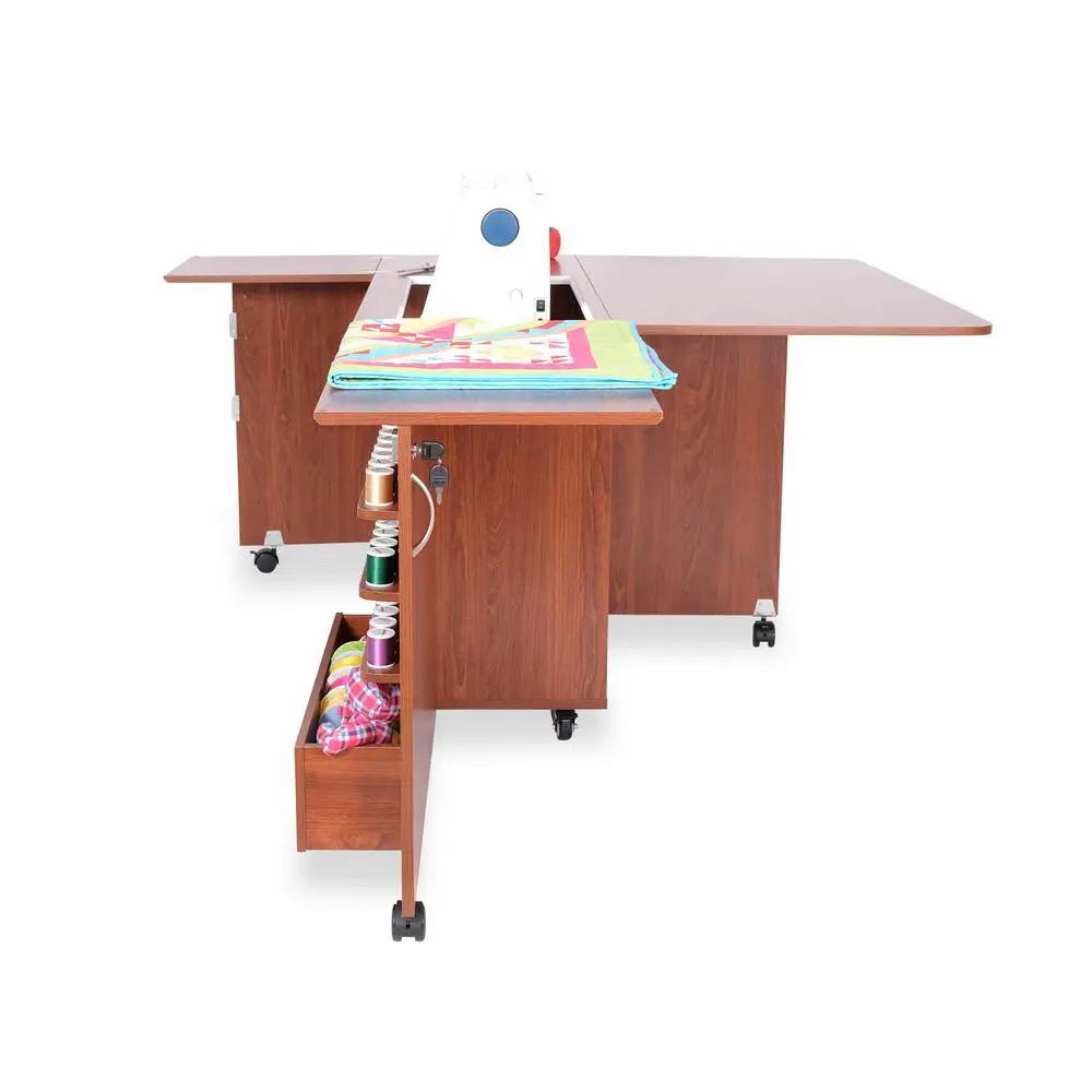 Sewing cabinet set in teak finish with extendable side table, rolling base, and built-in thread/spool storage