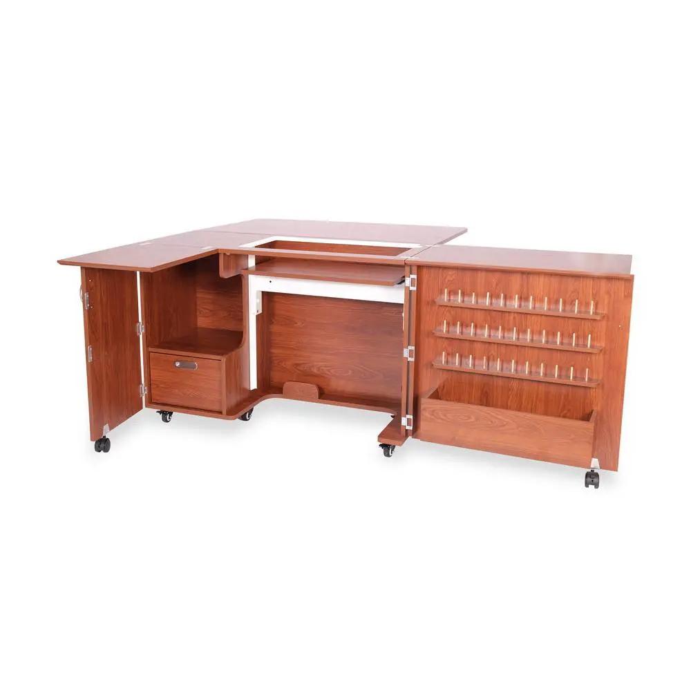 Kangaroo Wallaby II Studio teak sewing cabinet with left door, drawer, center workspace, and right pegboard on casters