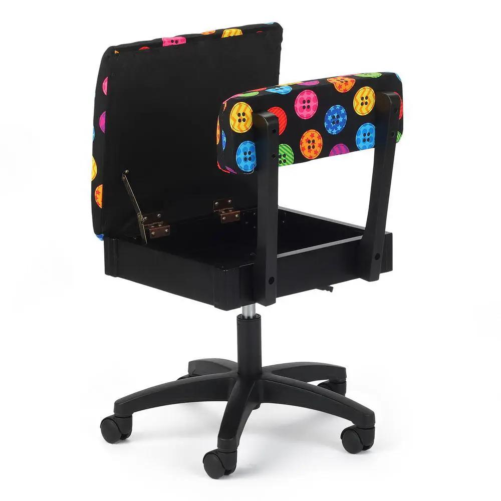 Sewing cabinet set by Kangaroo Sewing Furniture on a wheeled chair base with colorful button-pattern upholstery