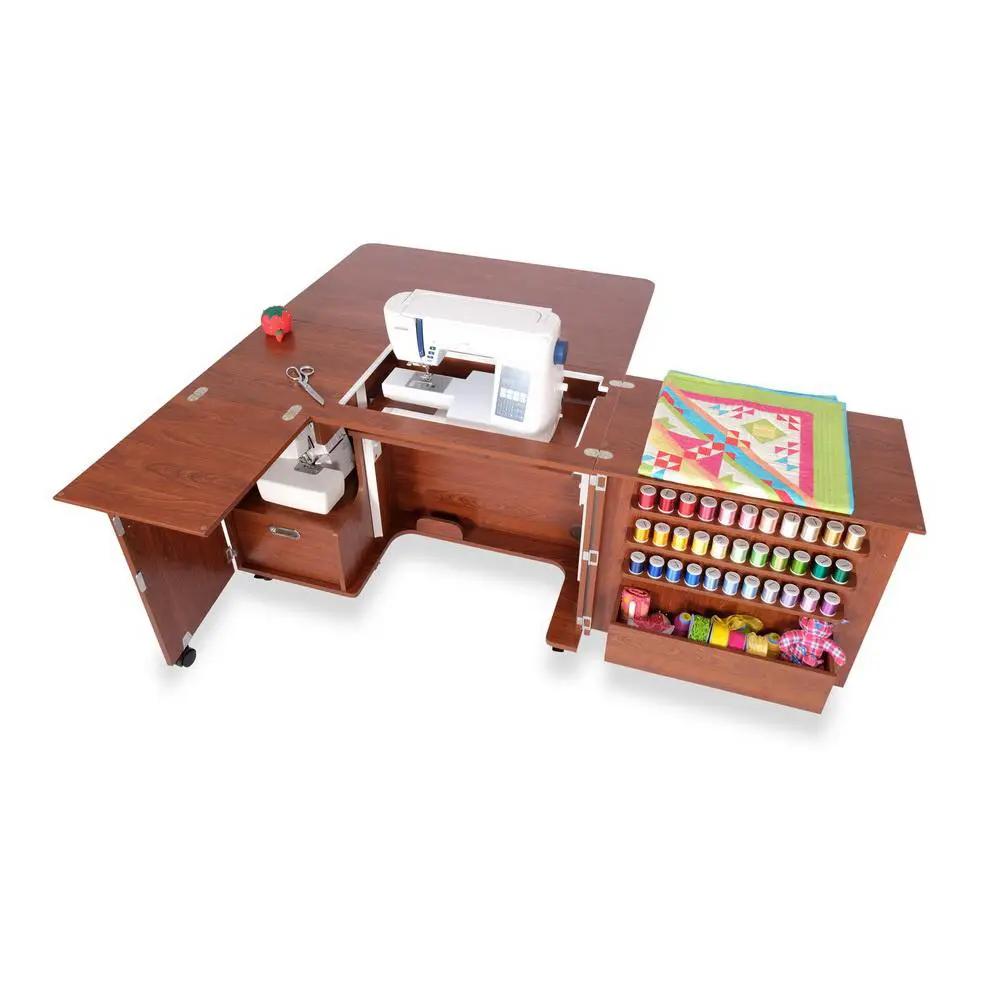 Kangaroo Wallaby II Studio sewing cabinet in teak with air lift; includes Dingo II and visible thread spools.