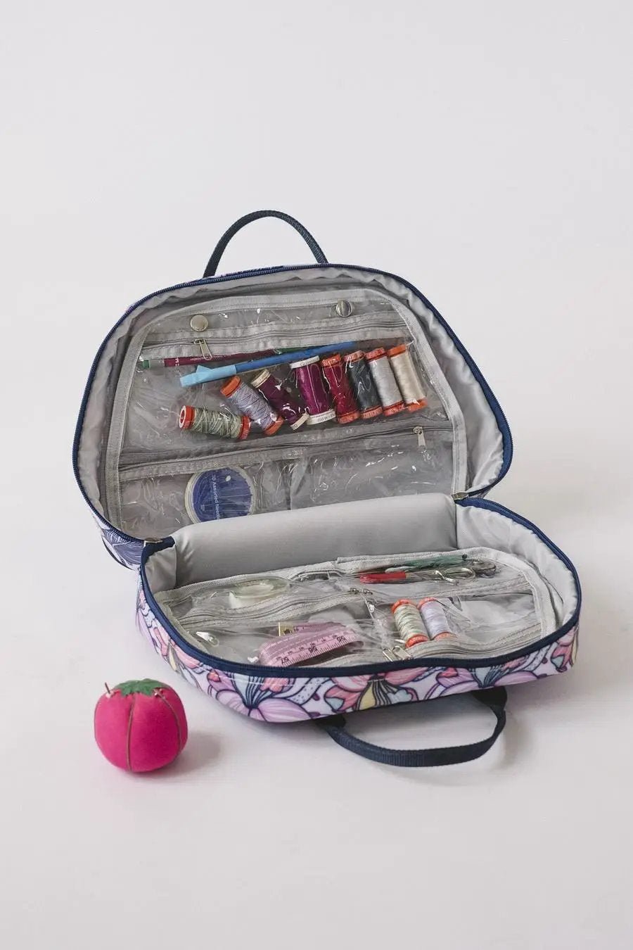 Bluefig Quilter Deluxe Combo 19in wheeled sewing bag with project and thread carrier; purple floral exterior.