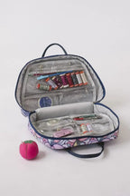 Bluefig Quilter Deluxe Combo 19in wheeled sewing bag with project and thread carrier; purple floral exterior.
