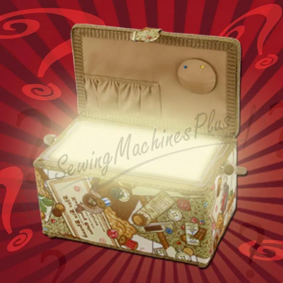 Notions sewing box, beige fabric case open to reveal spools, buttons and threads; SewingMachinesPlus watermark