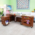 Kangaroo Sewing Furniture teak sewing cabinet set on wheels with drawers and open shelves.