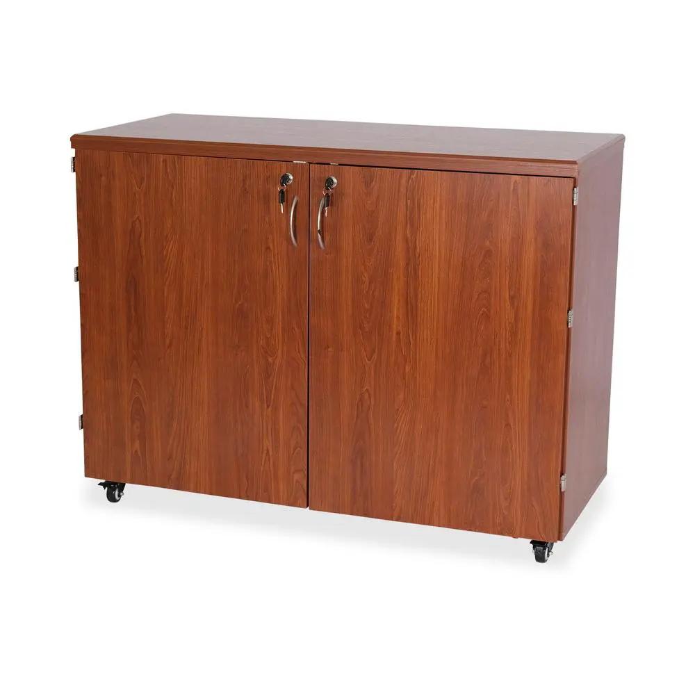 Sewing cabinet teak wood with two doors by Kangaroo Sewing Furniture on casters