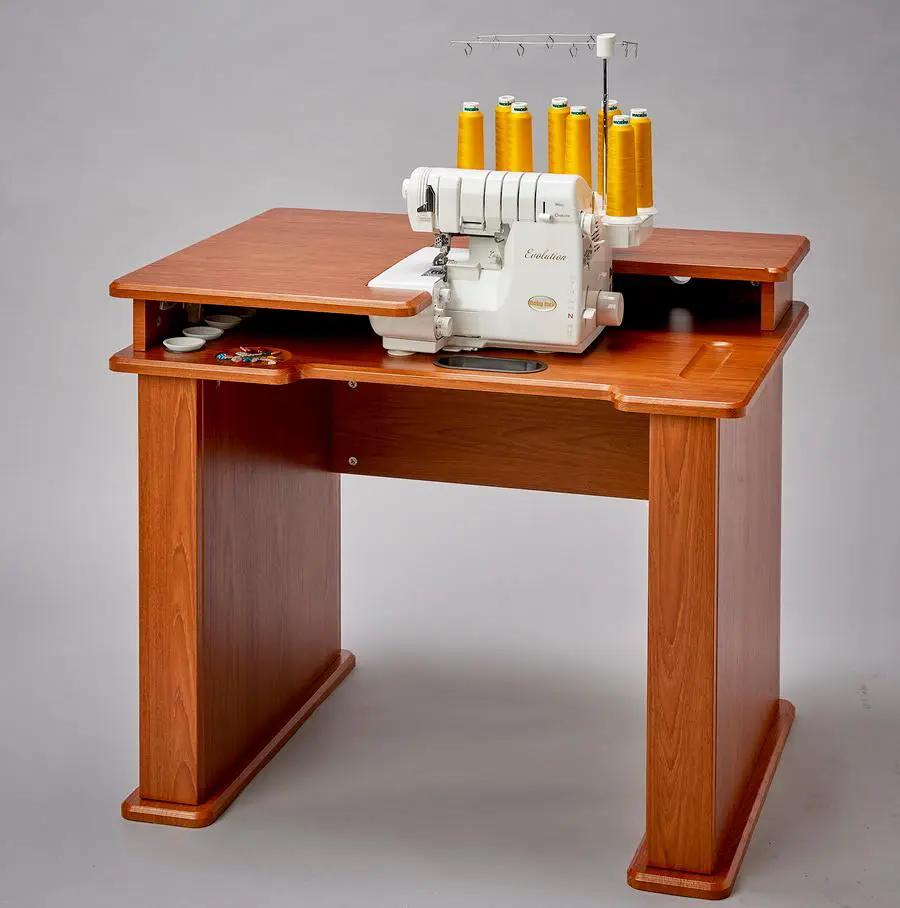 Koala Evolution Serger Station Cabinet in teak finish with white serger and yellow thread spools on top.