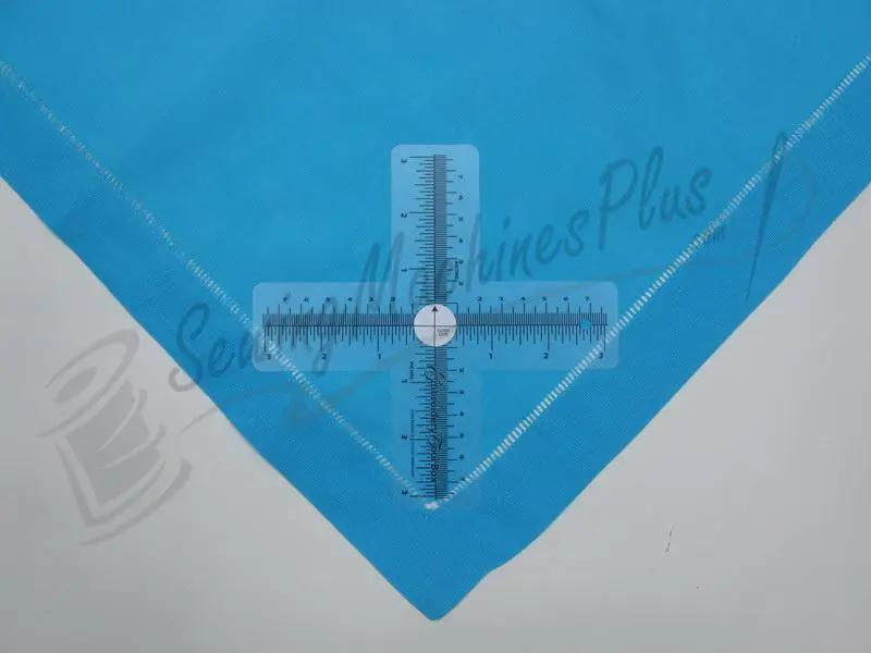 DIME machine embroidery blue fabric swatch with cross-shaped ruler overlay