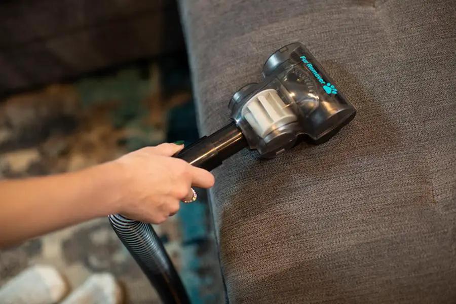 Simplicity S20PET Symmetry bagless upright vacuum on sofa