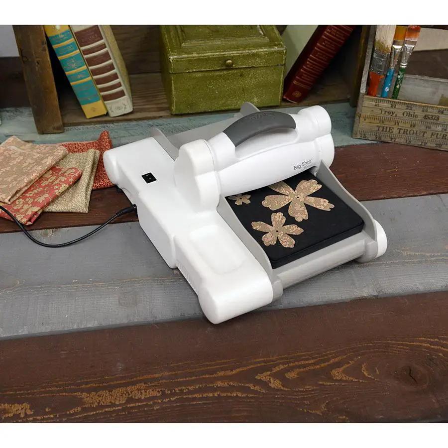 Sizzix Big Shot Express cutting machine in white and gray with cutting plate