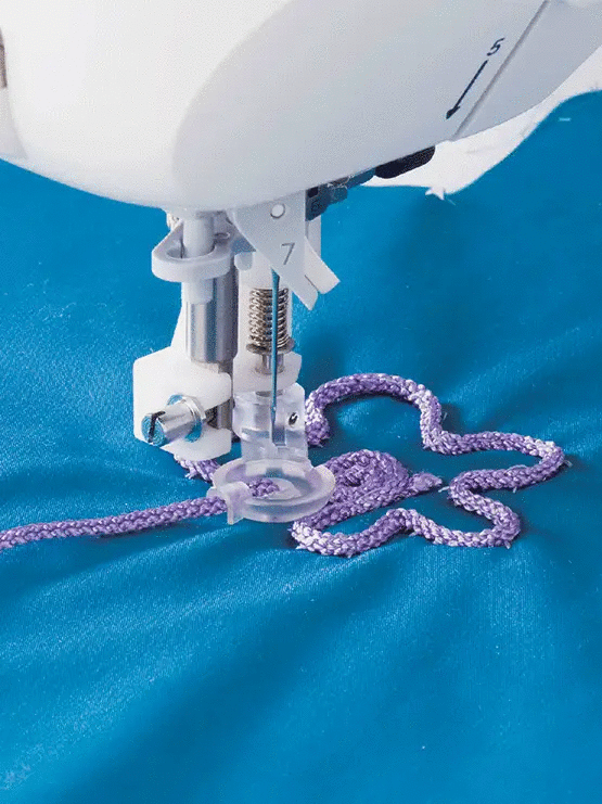 Juki cording & embroidery presser foot with purple braided cord on sewing machine
