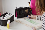 Bluefig paint brush easel carrying case, black roll-up with pink interior, stores brushes and art tools