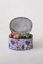 Bluefig Quilter Deluxe Combo bag set; round floral print project bag open to reveal colorful thread spools